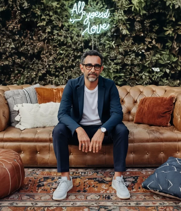 Gen4 The subject, a stylish man with glasses and a dark blazer, is sitting calmly in the c 397316456 (1)